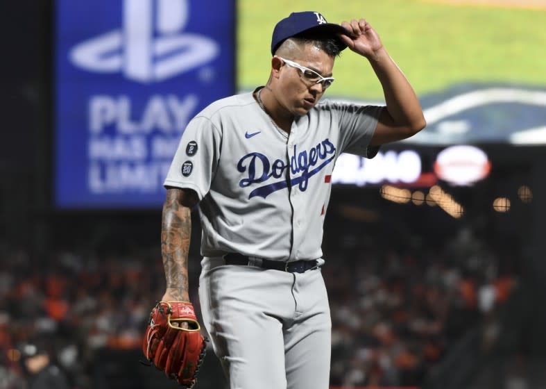 San Francisco, CA - October 09: Los Angeles Dodgers starting pitcher Julio Urias walks off the field during the second inning of game two in the 2021 National League Division Series against the San Francisco Giants at Oracle Park on Saturday, Oct. 9, 2021 in San Francisco, CA. (Wally Skalij / Los Angeles Times)