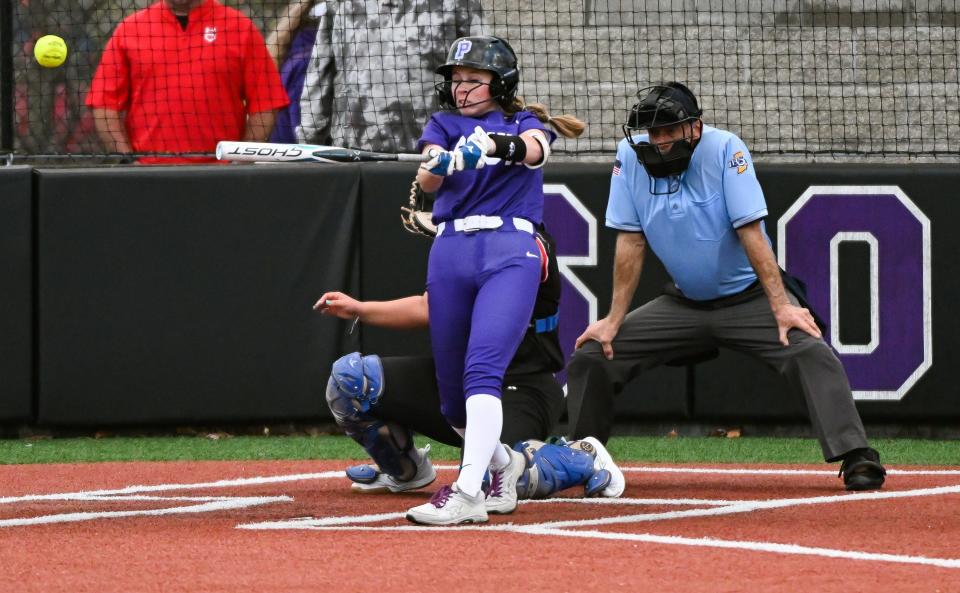 Bloomington South’s Evie Carpenter hits the ball during the softball game against Edgewood at Bloomington South on Tuesday, April 2, 2024.