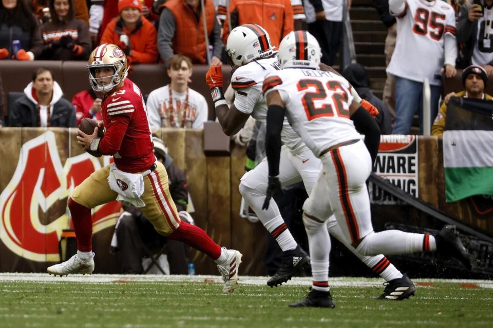 San Francisco 49ers quarterback Brock Purdy looks to throw the ball.