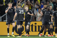 Nashville SC forward Sam Surridge, far left, is congratulated by teammates after his goal against CF Montréal during the first half of an MLS playoff soccer match Saturday, May 4, 2024, in Nashville, Tenn. (AP Photo/George Walker IV)