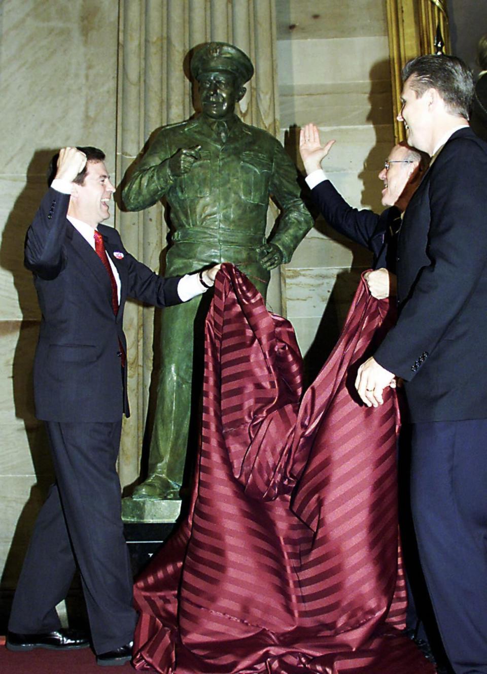 <div class="inline-image__caption"><p>Kansas Senators Sam Brownback and Pat Roberts celebrate the newly unveiled statue of Dwight D. Eisenhower in the Rotunda of the United States Capitol June 04, 2003.</p></div> <div class="inline-image__credit">TIM SLOAN/Getty</div>