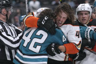 Anaheim Ducks left wing Max Comtois (44) fights with San Jose Sharks left wing Jonah Gadjovich (42) during the third period of a preseason NHL hockey game in San Jose, Calif., Tuesday, Sept. 27, 2022. San Jose won 5-4. (AP Photo/Tony Avelar)