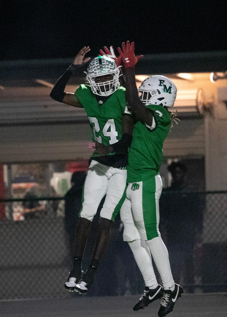 Madrid Tucker and Frank Starks of Fort Myers celebrate Tucker's touchdown at the end of the second quarter against Cape Coral on Thursday night, Nov. 2, 2023, at Fort Myers High School.