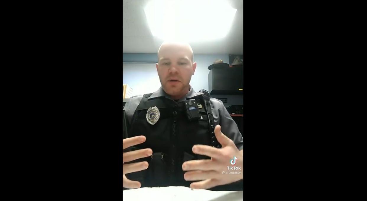 <p>A US police officer shows how taser is different from a handgun in Tiktok video</p> (Screengrab/@brian1504)