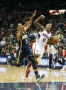Atlanta Hawks guard Jeff Teague (0) trips as he breaks for the goal against Indiana Pacers guard George Hill (3) in the second half of Game 3 of an NBA basketball first-round playoff series on Thursday, April 24, 2014, in Atlanta. The Hawks won 98-85. (AP Photo/John Bazemore)