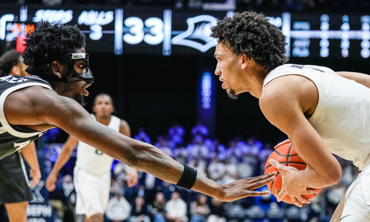 Xavier Musketeers guard Desmond Claude (1) right looks to make a pass as Providence Friars guard Ticket Gaines (0) plays defense in the second half Wednesday, February 21, 2024 at the Cintas Center.