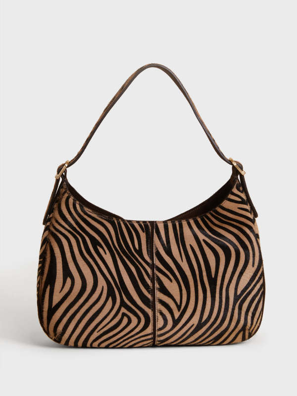 Rouje Big Zebra Bag in Suede, $495, <a href="https://us.rouje.com/products/big-bag-zebre-beige" rel="nofollow noopener" target="_blank" data-ylk="slk:available here;elm:context_link;itc:0;sec:content-canvas" class="link ">available here</a>