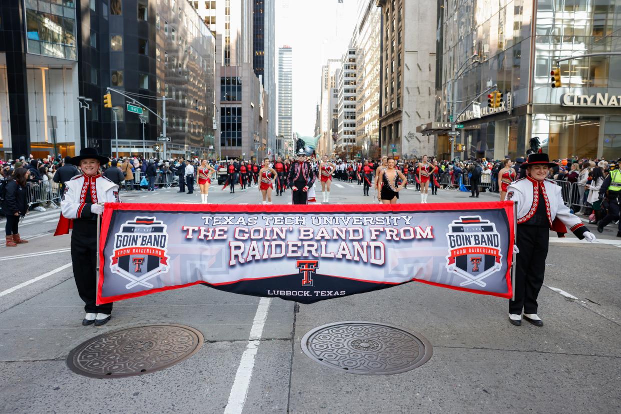 Goin' Band from Raiderland carrying the band's banner in Macy's Thanksgiving Day Parade on Nov. 23 in New York City, New York.