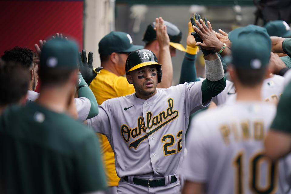 Oakland Athletics' Ramon Laureano, center, is congratulated by teammates after hitting a two-run home run during the fourth inning of a baseball game against the Los Angeles Angels, Thursday, Aug. 4, 2022, in Anaheim, Calif. (AP Photo/Jae C. Hong)