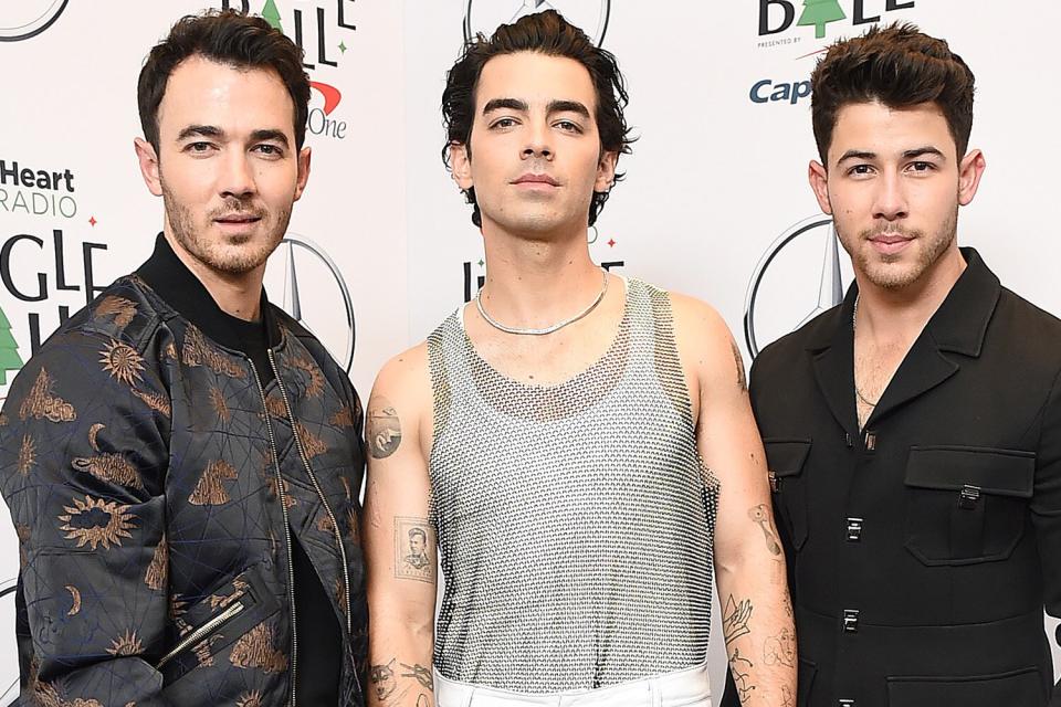 NEW YORK, NEW YORK - DECEMBER 10: (L-R) Kevin Jonas, Joe Jonas, and Nick Jonas of The Jonas Brothers attend the iHeartRadio Z100 Jingle Ball 2021 on December 10, 2021 in New York City. (Photo by Ilya S. Savenok/Getty Images for iHeartRadio )