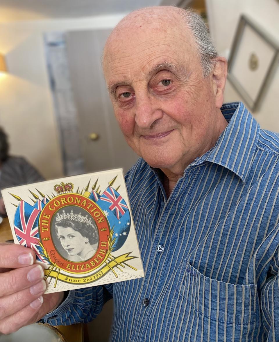 Tony Wober with the brochure from the day of the late Queen's coronation. (Supplied)