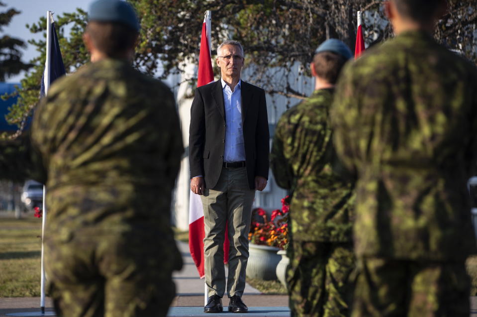 NATO Secretary General Jens Stoltenberg takes part in an Guard of Honor inspection at 4 Wing Cold Lake air base in Cold Lake Alta, on Friday Aug. 26, 2022. (Jason Franson /The Canadian Press via AP)