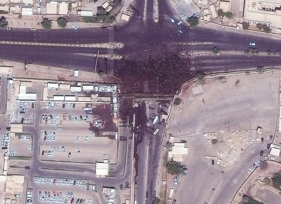 This satellite image provided by Maxar Technologies shows crowds near the Iraq Parliament building in Baghdad Iraq on Saturday, July 30, 2022. Thousands of followers of Muqtada al-Sadr, an influential Shiite cleric, breached Iraq's parliament on Saturday, for the second time this week, protesting government formation efforts lead by his rivals, an alliance of Iran-backed groups. (Satellite image ©2022 Maxar Technologies via AP)