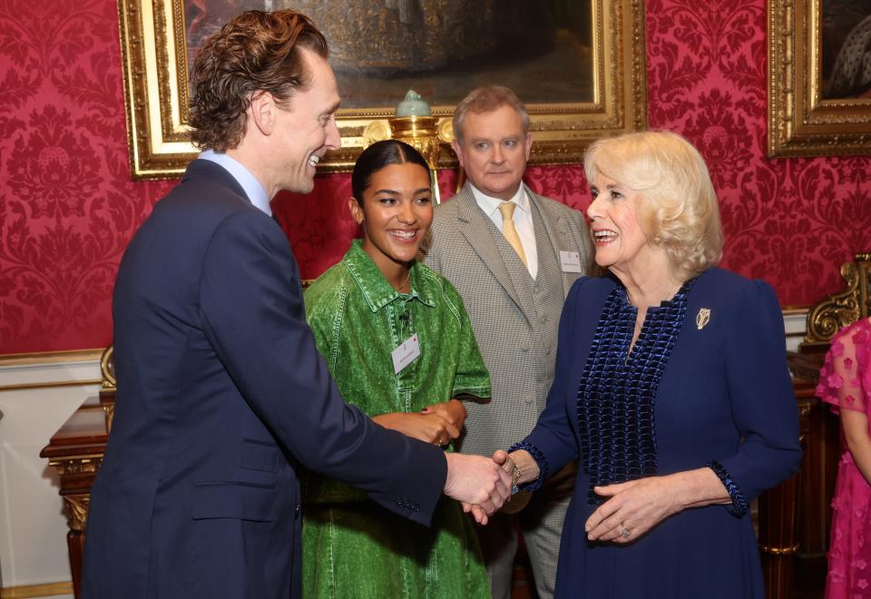 Queen Camilla shakes hands with Tom Hiddleston during a reception at Buckingham Palace in London on Wednesday (Chris Jackson/PA Wire)