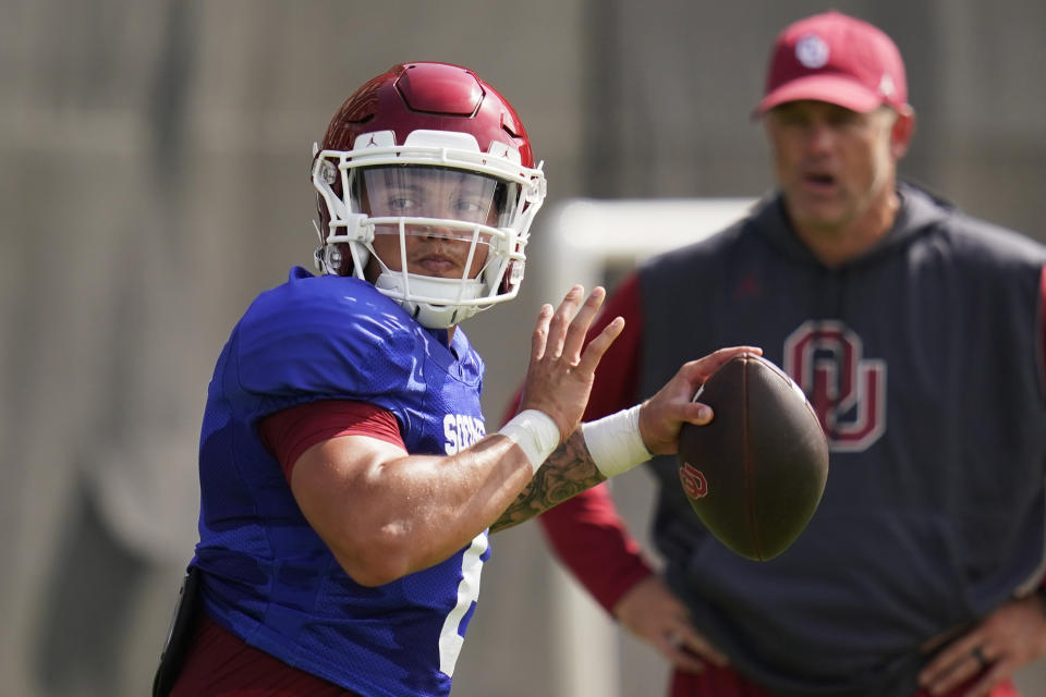 FILE - Oklahoma quarterback Dillon Gabriel throws during an NCAA college football practice, Monday, Aug. 8, 2022, in Norman, Okla. Gabriel threw 32 touchdown passes and ranked second among all FBS players with 373.9 yards of total offense per game for UCF in 2020, but he played just three games in 2021 before a broken clavicle knocked him out for the remainder of the season. Gabriel now takes over at Oklahoma, which has playing time available at quarterback. (AP Photo/Sue Ogrocki, File)