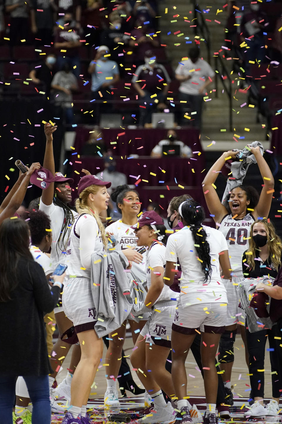 Members of the Texas A&M Aggies react after a win over South Carolina in an NCAA college basketball game Sunday, Feb. 28, 2021, in College Station, Texas. (AP Photo/Sam Craft)