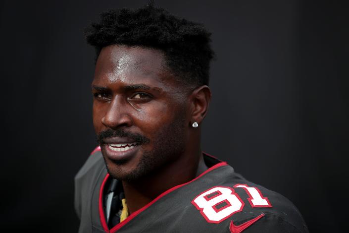 FILE - Tampa Bay Buccaneers wide receiver Antonio Brown (81) smiles while entering the tunnel at halftime during an NFL football game against the Atlanta Falcons in Tampa, Fla., in this Sunday, Jan. 3, 2021