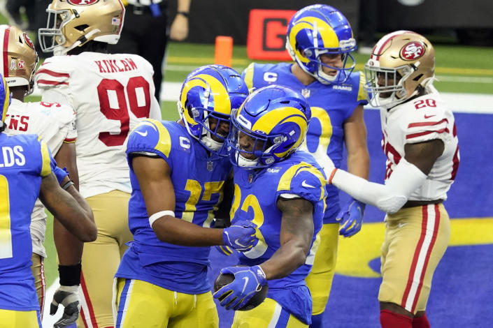 Los Angeles Rams running back Cam Akers (23) celebrates his rushing touchdown with Robert Woods (17) during the second half of an NFL football game against the San Francisco 49ers Sunday, Nov. 29, 2020, in Inglewood, Calif. (AP Photo/Alex Gallardo)