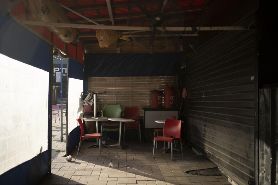 Tables and chairs at a restaurant that has closed due to Israel's war with Hamas in Sderot, Israel, Wednesday, Oct. 25, 2023. Israel's economy bounced back after previous wars with Hamas, but this round could last longer, possibly months, because the military's self-declared mission is to end Hamas rule, not just contain the militants. (AP Photo/Maya Alleruzzo)