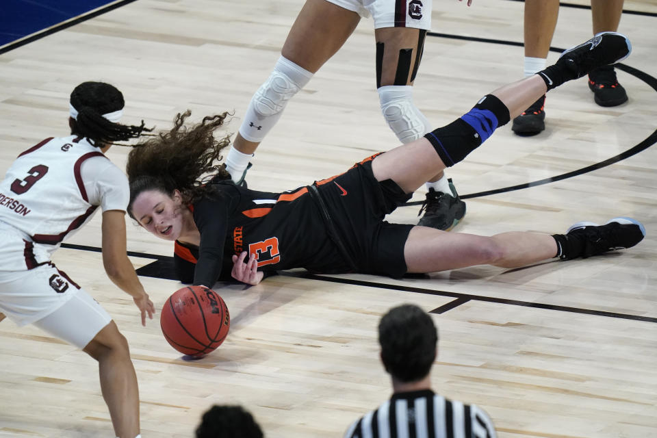 Oregon State guard Sasha Goforth (13) loses control of the ball in front of South Carolina guard Destanni Henderson (3) during the first half of a college basketball game in the second round of the women's NCAA tournament at the Alamodome in San Antonio, Tuesday, March 23, 2021. (AP Photo/Eric Gay)