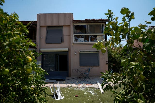 A damaged house is seen following an attack from Lebanon, in Acre, north Israel on Sunday