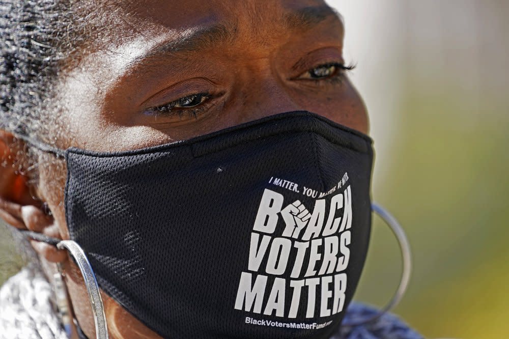 In this Nov. 2, 2020, file photo, Sharon Brown, co-chair of the Mississippi Poor Peoples Campaign, reacts during a news conference at the state Capitol in Jackson, Miss., over voting concerns statewide. (AP Photo/Rogelio V. Solis, File)