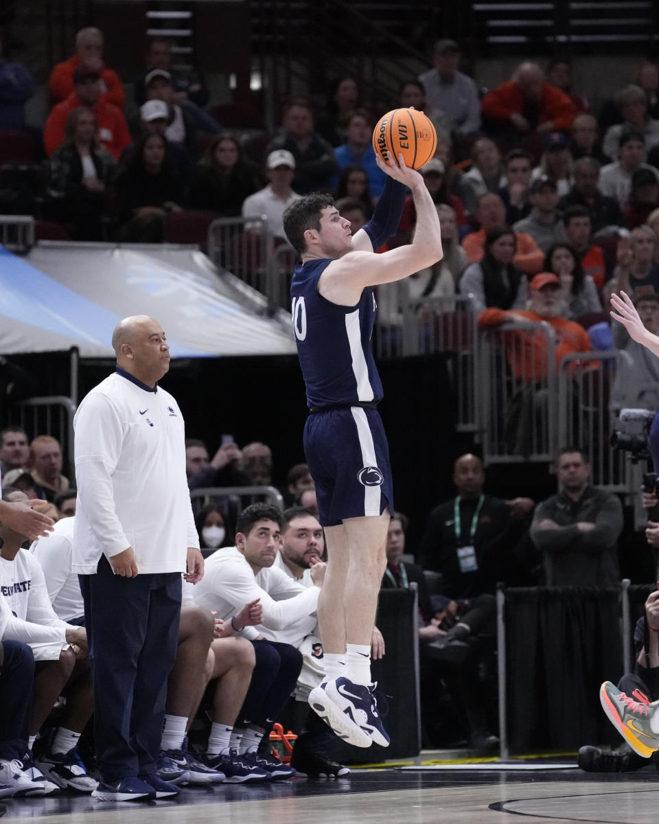 Penn State's Andrew Funk shoots as head coach Micah Shrewsberry watches during the second half of an NCAA college basketball game against Illinois at the Big Ten men's tournament, Thursday, March 9, 2023, in Chicago. Penn State won 79-76. (AP Photo/Charles Rex Arbogast)