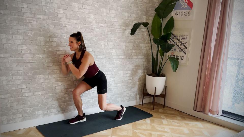 aerobic workout, amber rees performs squat to tap back exercise