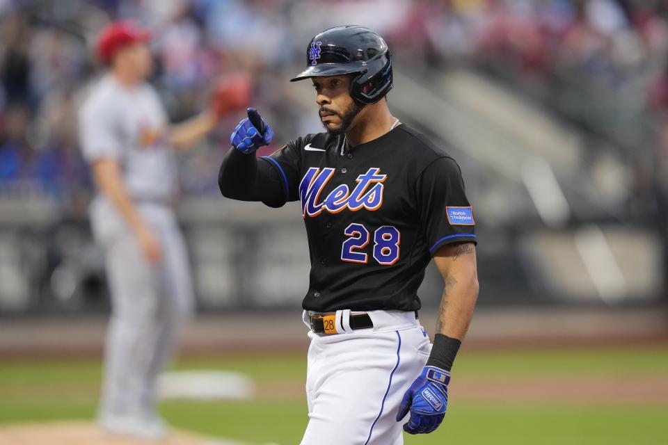 New York Mets' Tommy Pham (28) gestures to teammates after hitting an RBI single against the St. Louis Cardinals during the third inning of a baseball game Friday, June 16, 2023, in New York. (AP Photo/Frank Franklin II)