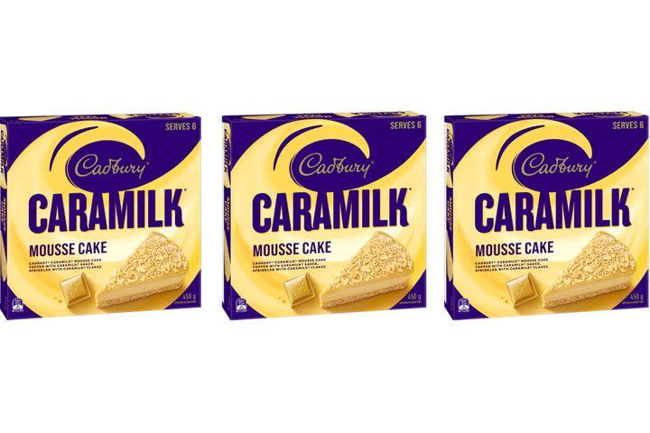 Three boxes of Caramilk Mousse Cake in gold and purple packaging