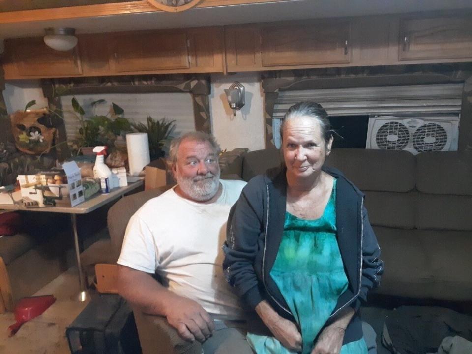 Therese and John Rubiolo sit in a trailer in Concow, California, where they've been living since the Camp fire destroyed their home. (Photo: Courtesy of Therese Rubiolo)