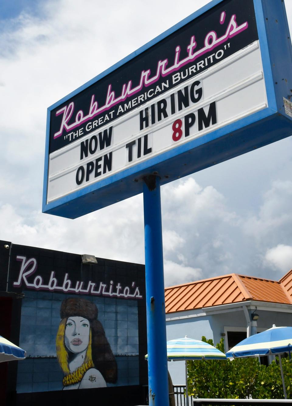 The sign outside Robburrito's in Melbourne Beach advertises that the restaurant is looking  for an additional cook.