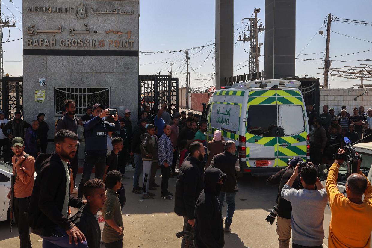 One of the ambulances carrying the bodies of staff members of the U.S.-based aid group World Central Kitchen arrives at the Rafah crossing with Egypt in the southern Gaza Strip on April 3, 2024.