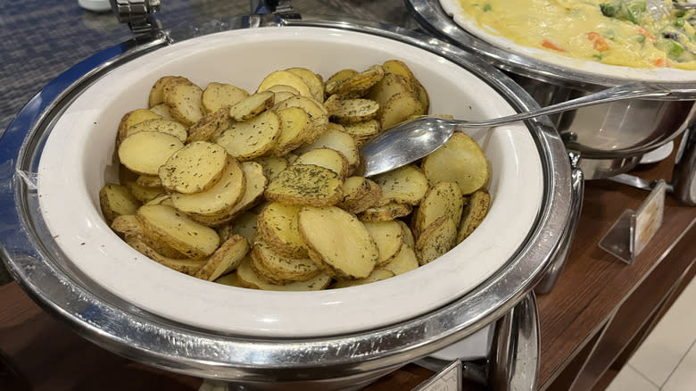 Lyonnaise potatoes in buffet dish