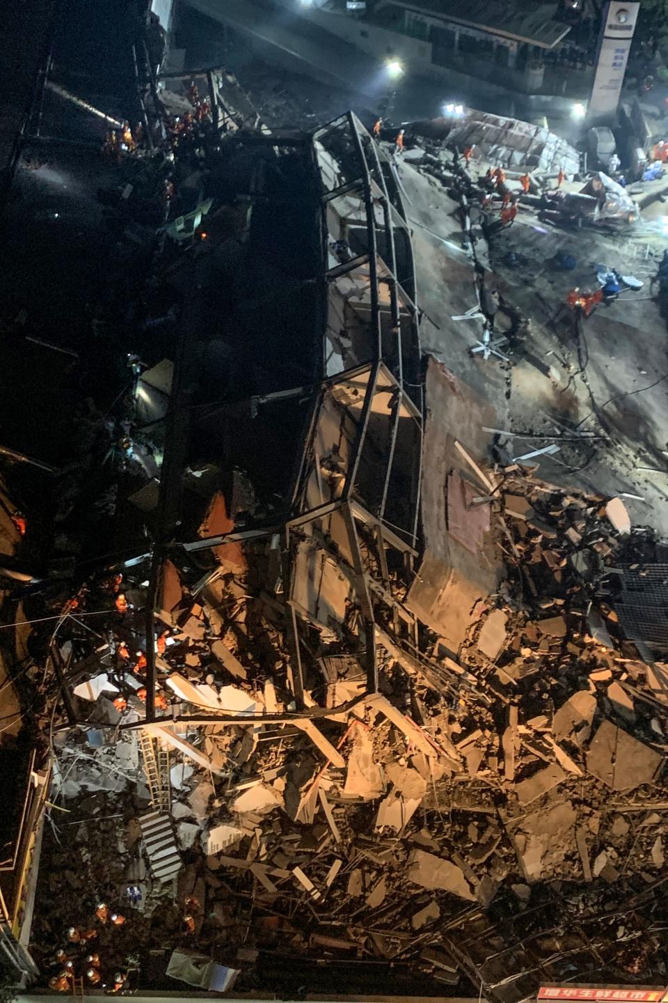 Rescuers search for survivors in the rubble of a collapsed hotel in Quanzhou, in China's eastern Fujian province on March 7, 2020. - Around 70 people were trapped after the Xinjia Hotel collapsed on March 7 evening, officials said. (Photo by STR / AFP) / China OUT (Photo by STR/AFP via Getty Images)