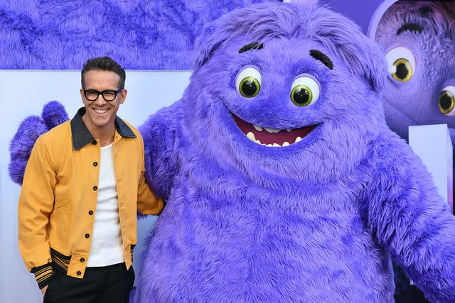 <p>ANGELA WEISS/AFP via Getty</p> Ryan Reynolds and Blue from 'IF"