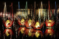 <p>Lotus-shaped illuminated lanterns float during Vesak celebrations on Beira Lake in Colombo, Sri Lanka, May 22, 2016. Vesak is a holiday with a majority population of Buddhists. The day marks the birth, enlightenment and demise of Buddha and is celebrated in Sri Lanka with illuminated pandals, lanterns and ‘dansals’ or free offer of food, drinks and refreshment to the wayfarers. This year, most of these dansals were absent following devastating monsoonal floods and landslides in some areas. (M.A.PUSHPA KUMARA/EPA) </p>