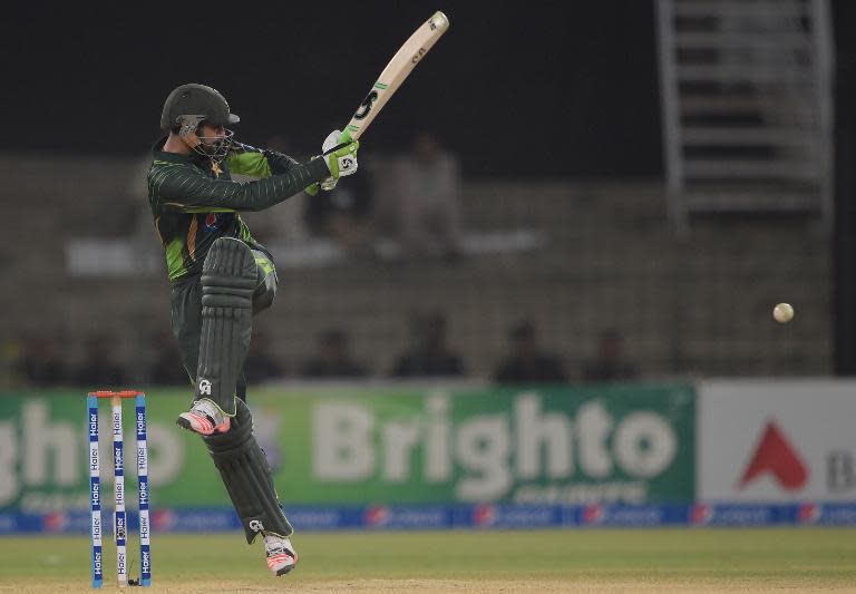 Pakistan's Shoaib Malik plays a shot during the second One Day International (ODI) cricket match between Pakistan and Zimbabwe at the Gaddafi Cricket Stadium in Lahore on May 29, 2015