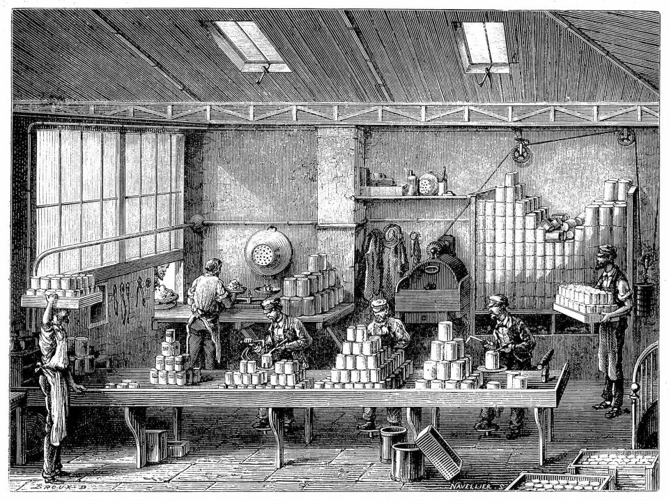 An engraving from the 1800s of several people filling and soldering cans of food in a factory