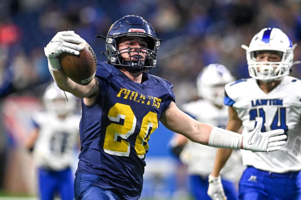 Pewamo-Westphalia's Dak Ewalt celebrates after scoring a touchdown against Lawton to put the Pirates ahead during the fourth quarter on Saturday, Nov. 27, 2021, at Ford Field in Detroit.