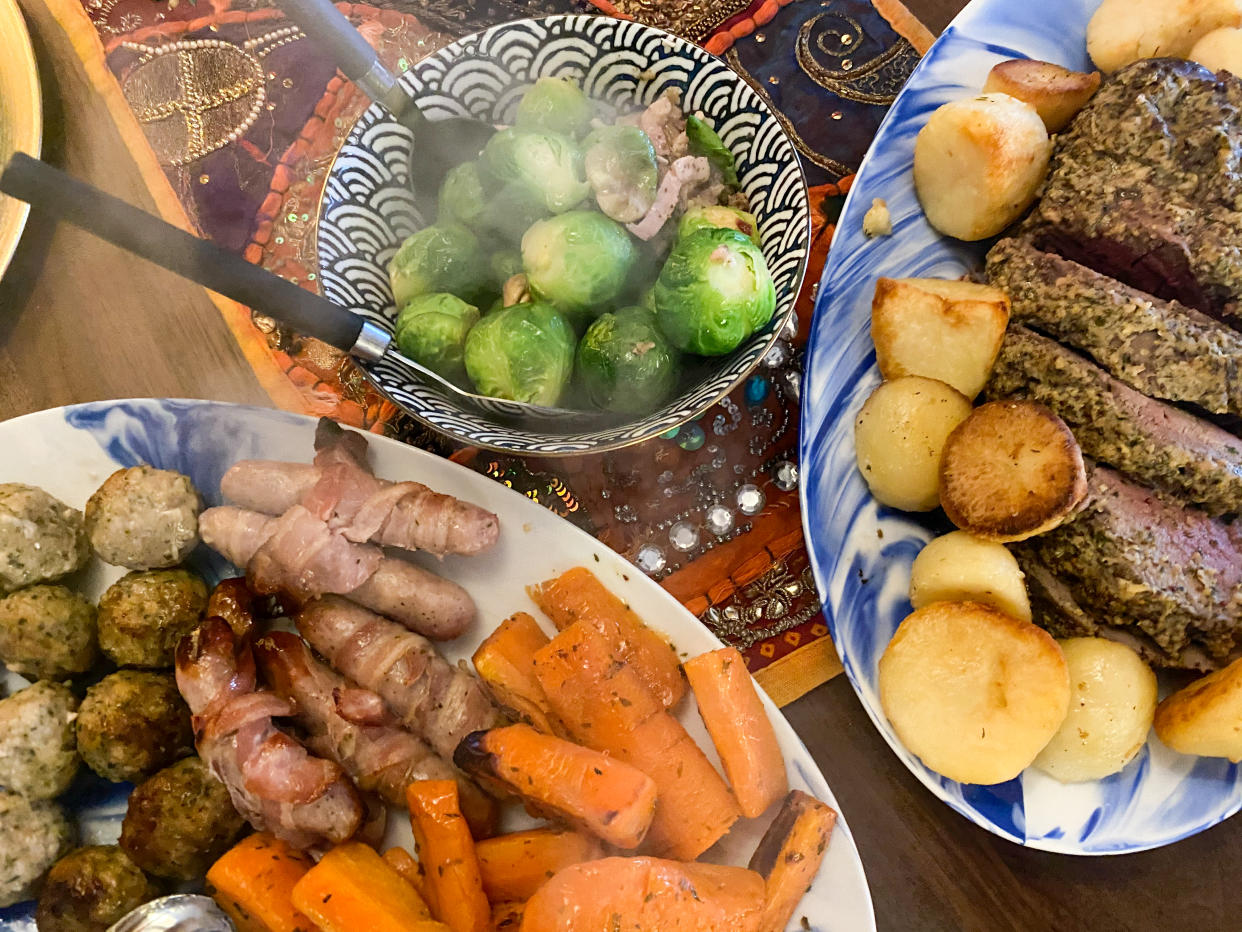 grocery Topside Beef Christmas Lunch incorporating stuffing balls, glazed carrots, roasted potatoes, pigs in a blanket and Brussels sprouts