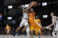 Tennessee forward Tobe Awaka (11) collides with Vanderbilt guard Ezra Manjon (5) as they went for a rebound during the second half of an NCAA college basketball game Wednesday, Feb. 8, 2023, in Nashville, Tenn. (AP Photo/Wade Payne)