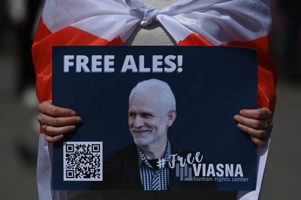 Members of the local Belarusian and Ukrainian diaspora, joined by dedicated activists, gather at the main Market Square in Krakow for the 'Freedom to Political Prisoners of Belarus' protest, on Sunday, May 21, 2023, in Krakow, Poland. (Artur Widak/NurPhoto via Getty Images)