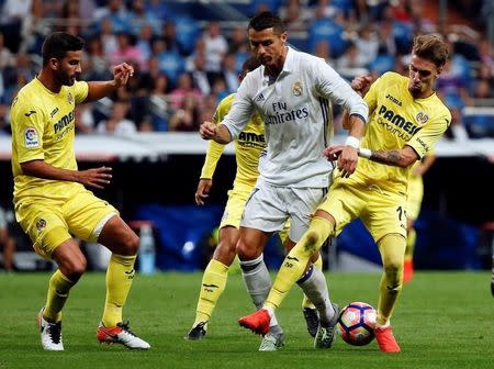 Football Soccer - Real Madrid v Villarreal - Spanish Liga Santander - Santiago Bernabeu, Madrid, Spain - 21/09/16. Real Madrid's Cristiano Ronaldo and Villarreal's Mateo Musacchio and Samuel Castillejo in action. REUTERS/Sergio Perez