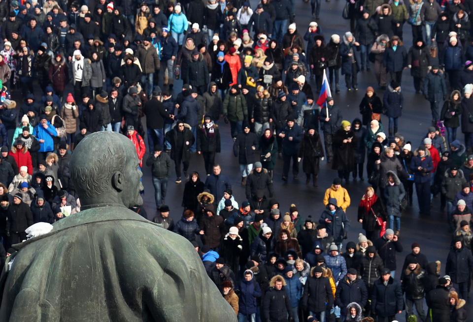 <p>People rally in support of Russia’s incumbent President Vladimir Putin outside the Luzhniki Stadium ahead of the 2018 Russian presidential election scheduled for March 18. (Photo: Stanislav Krasilnikov/TASS via Getty Images) </p>