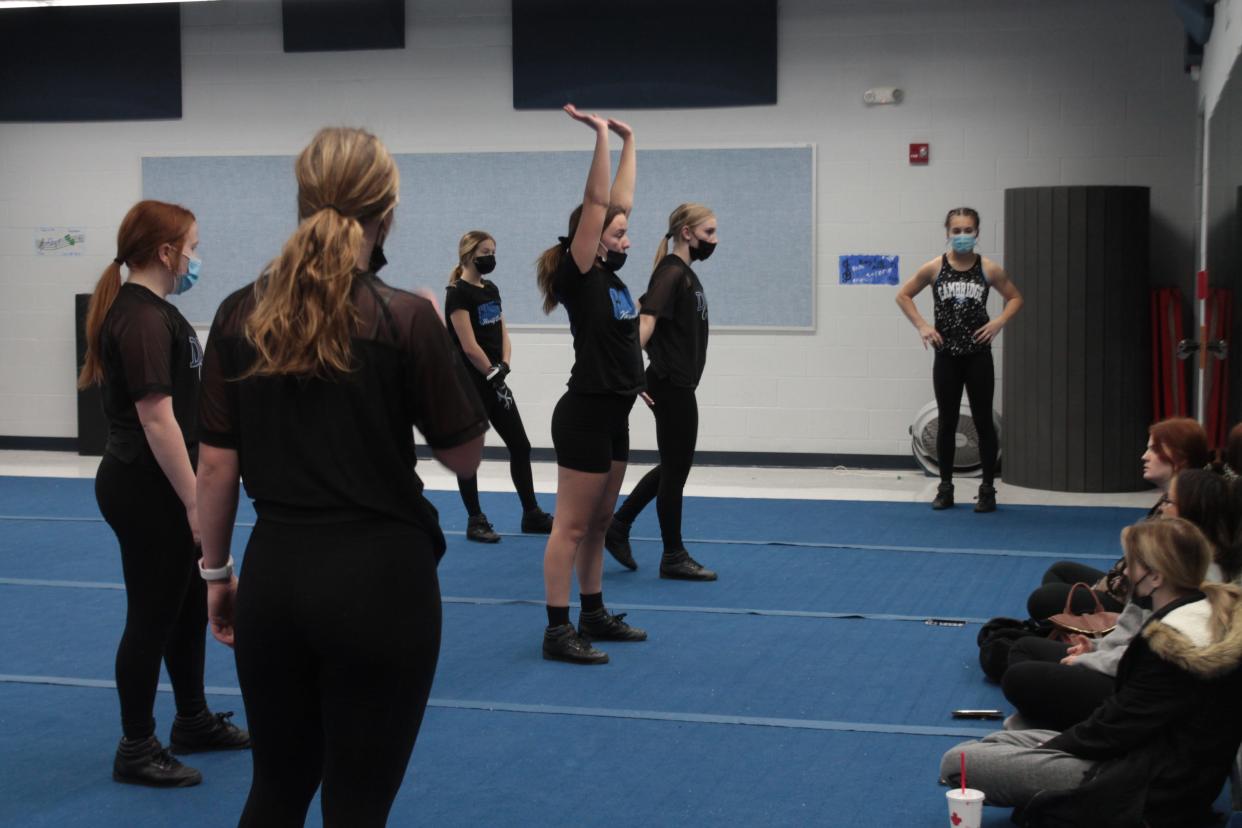 Cambridge High School Dance Team co-captain Kiersten Keith-Hill demonstrates the proper way to do a dance move during dance practice.