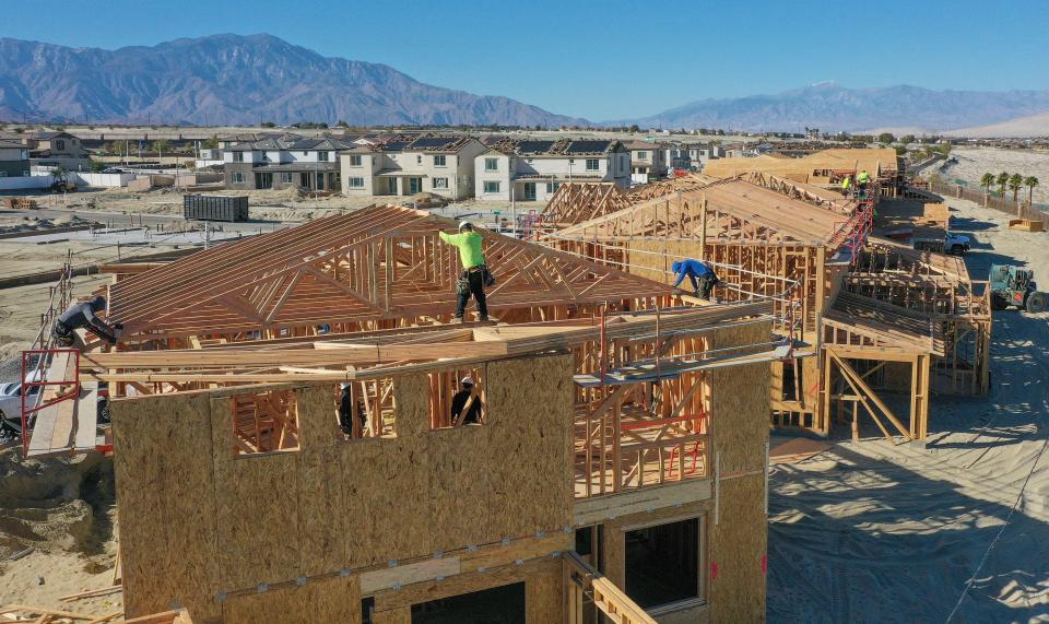 Construction workers frame new homes in November 2022 in University Park in north Palm Desert.