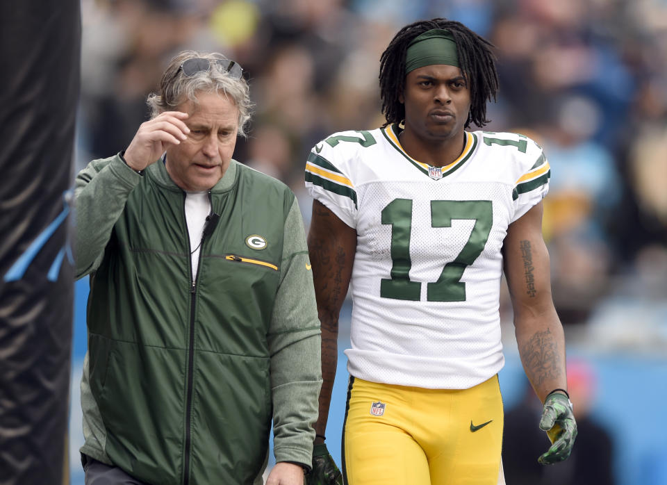 Green Bay Packers’ Davante Adams (R) is helped off the field after being injured against the Carolina Panthers on Sunday, Dec. 17, 2017. (AP Photo/Mike McCarn)