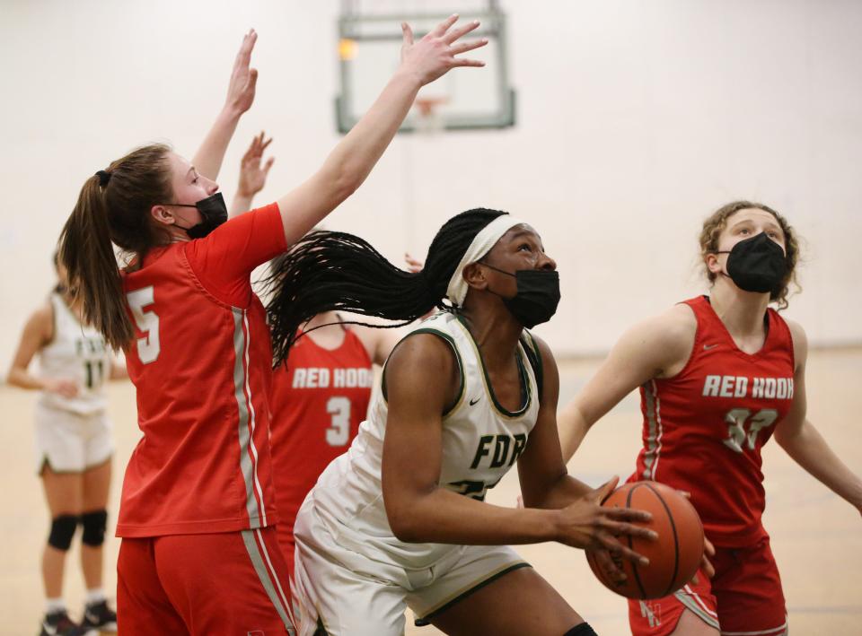 FDR's Nkiru Awaka is covered by Red Hook's, from left, McKenzie Simmons and Stellah Mariental-LeGendre during Wednesday's game in Staatsburg on January 26, 2022.