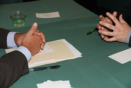 Hands at an interview table